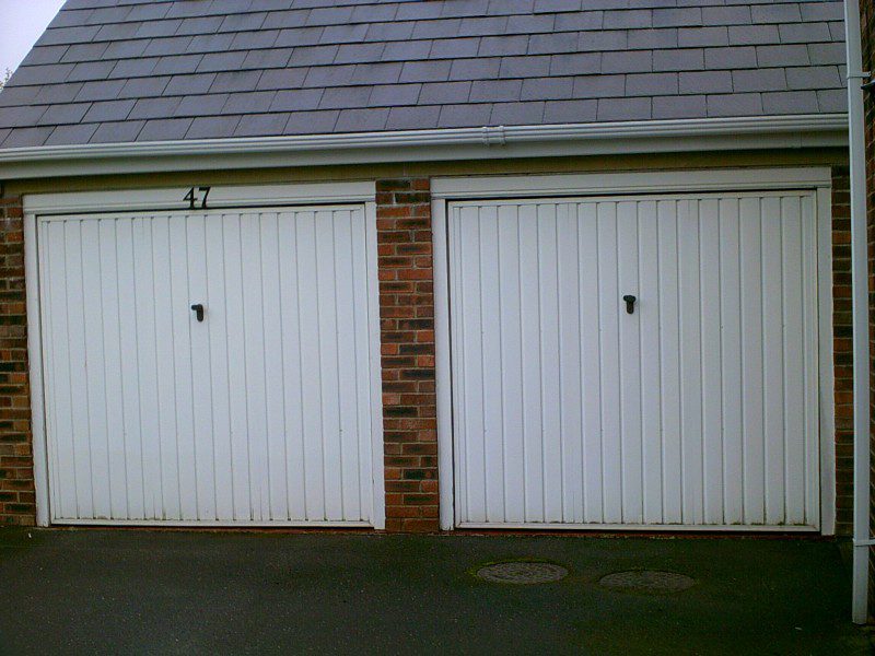 White Sectional Smooth Finish Garage Door (Before)