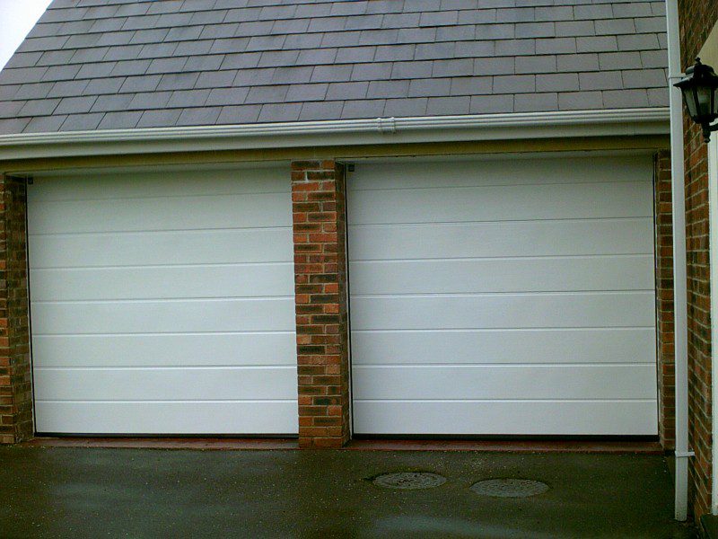 White Sectional Smooth Finish Garage Door (After)