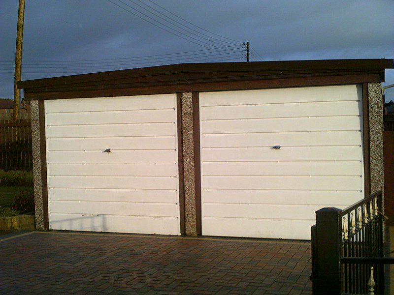 White Linear Sectional Garage Doors (Before)