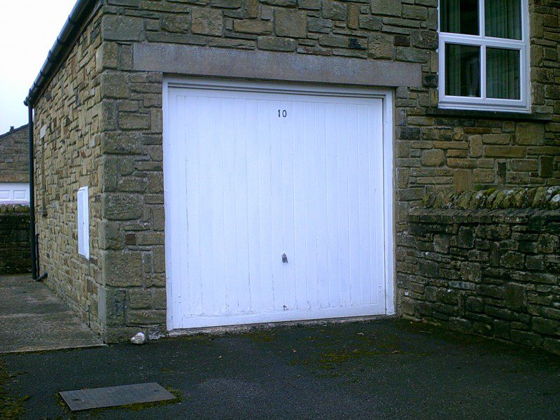 White Georgian Sectional Garage Door (Before)