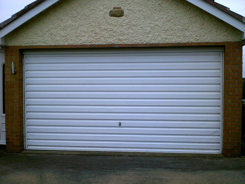 white rib Style Sectional Garage Door (Before)