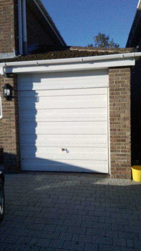 Blue Sectional Garage Door (Before)