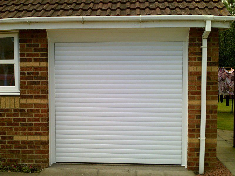 White Seceuroglide Remote Control Insulated Roller door (After)