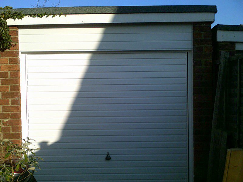 White Horizontal Rib Style Up and Over Garage Door (After)