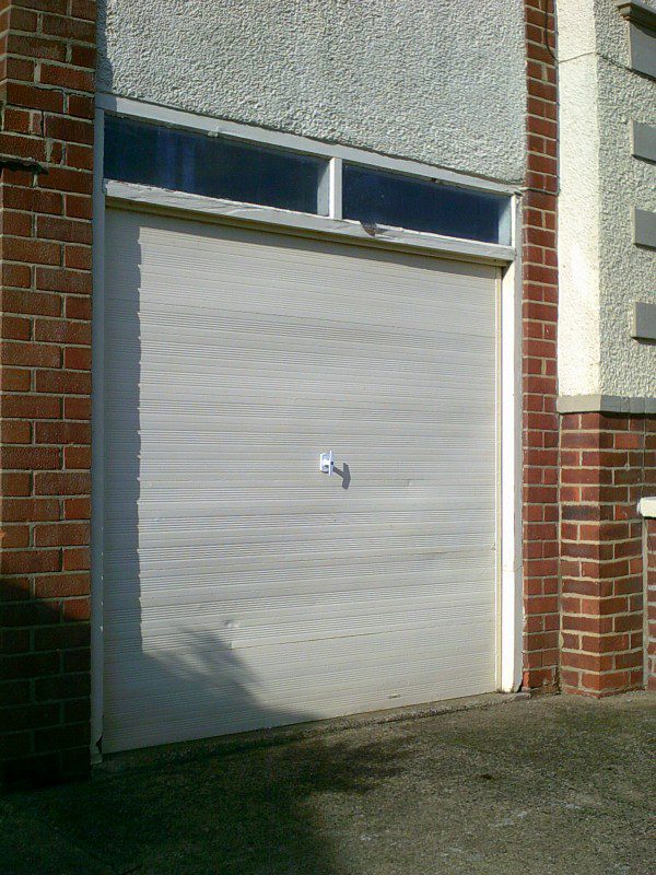 White Vertical Rib Style Garage Door (Before)