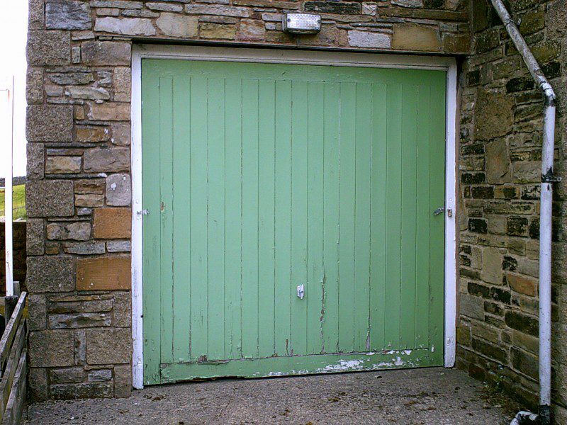 Horizontal Rib Style Up and Over Garage Door (Before)