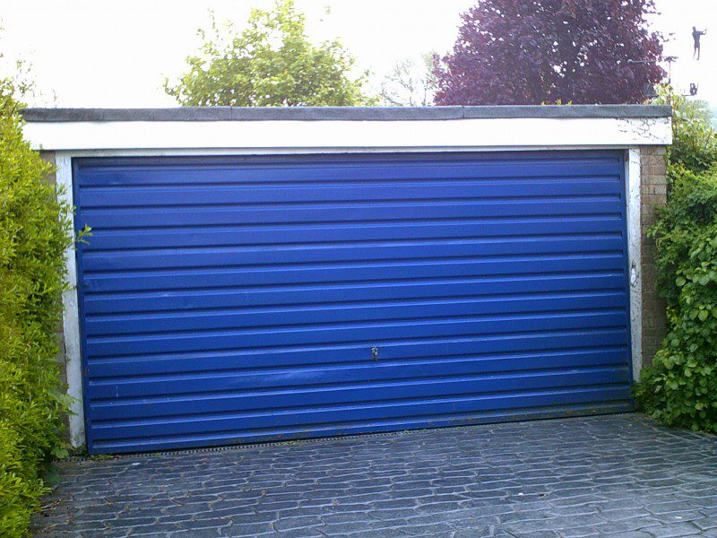 White Rib Style Sectional Garage Door (Before)