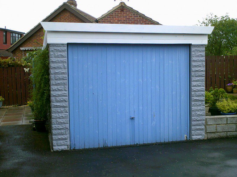 White Rib Style Up and Over Garage Door (Before)