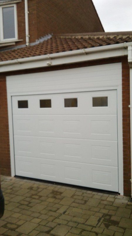 White Sectional Garage Door (After)