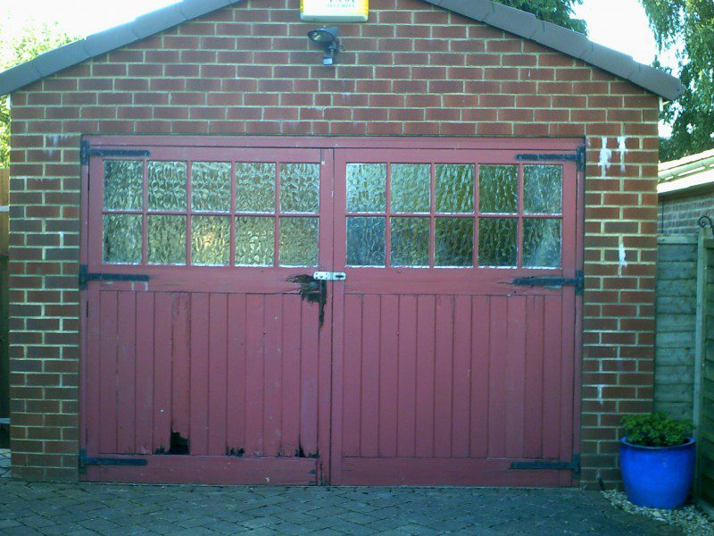 White Georgian Sectional Garage door (Before)