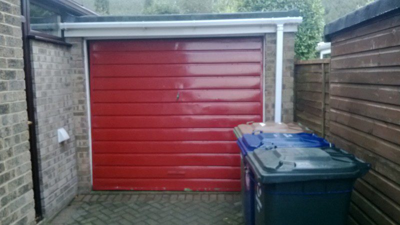 Rosewood Sectional Garage Door (Before)