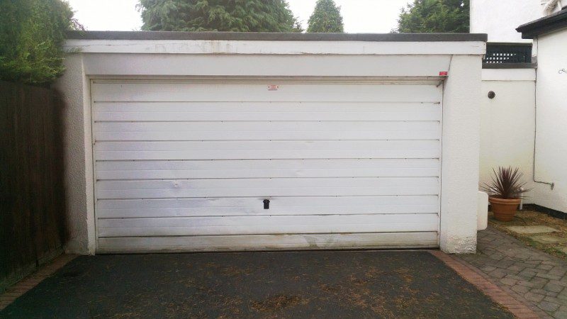 White Sectional Garage Doors with windows (Before)