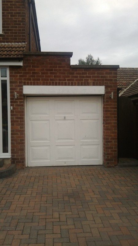 Golden Oak Laminated up and over garage door (Before)