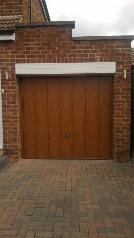 Golden Oak Laminated up and over garage door (After)