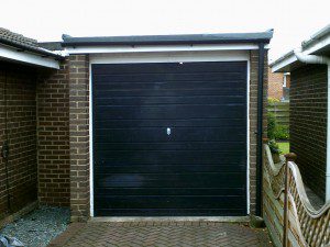 Green Carlton Garage Door (Before)