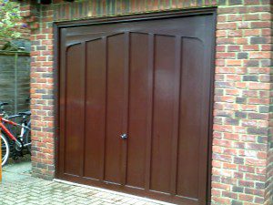 Rosewood Sectional Garage Door (Before)