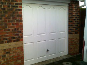 White Linear Sectional Garage Door (Before)