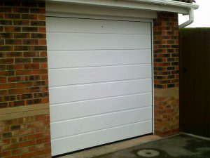 White Linear Sectional Garage Door (After)