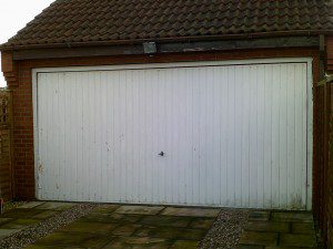 White Sectional Garage Door (Before)