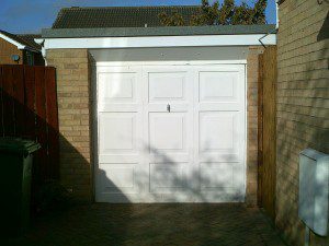 White Sectional Garage Door (Before)