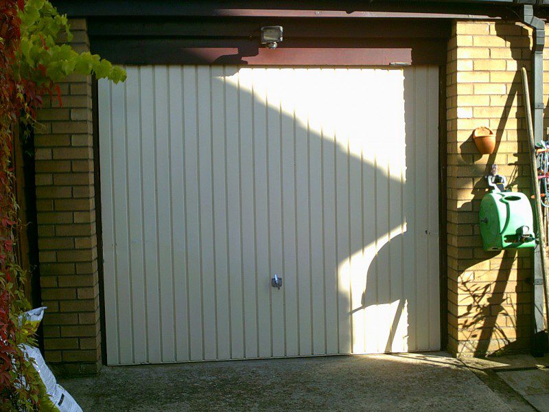Rosewood Sectional Garage Door (Before)