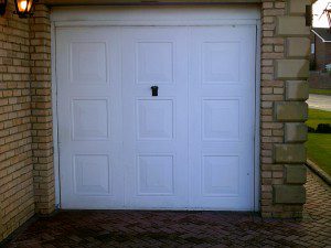 White Linear Sectional Garage Door (Before)