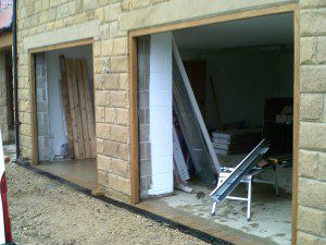 Ribbed Style White Sectional Garage Door (Before)