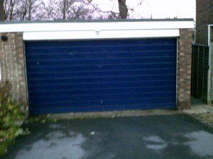 Green Insulated Roller Garage Door (Before)