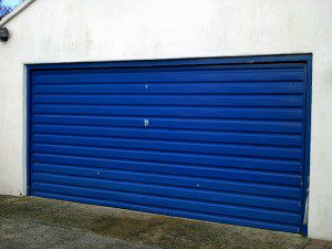 Linear Style Blue Sectional Garage Door (Before)