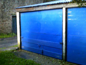 Green Retractable Garage Door (Before)