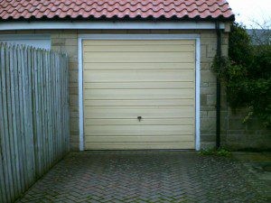 Ivory Sectional Garage Door (Before)