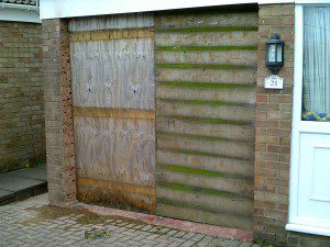 White Garador Sectional Garage Door (Before)