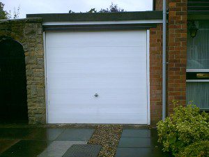 White Woodgrain Sectional Garage Door  (Before)