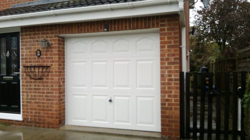 White Cathedral Style Up and Over Garage Door (After)