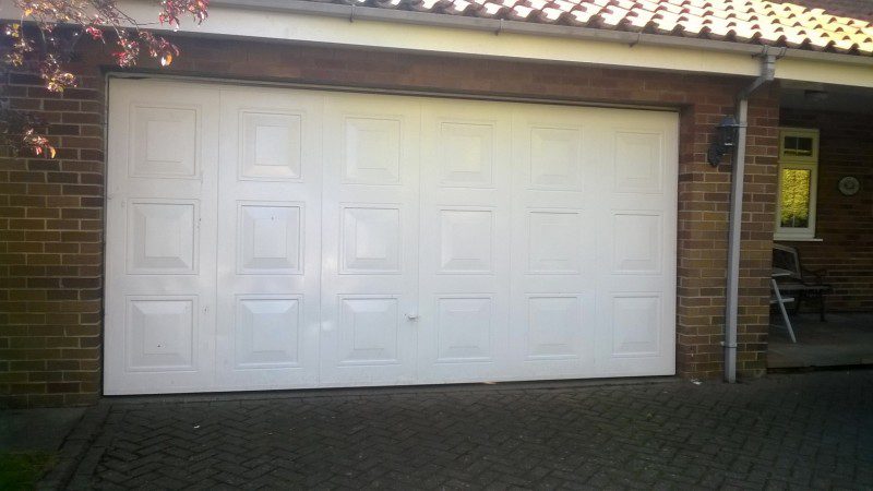  Double size Georgian style sectional door with windows  (Before)