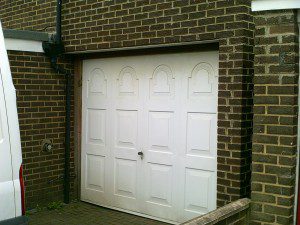 White Woodgrain Sectional Garage Door (Before)